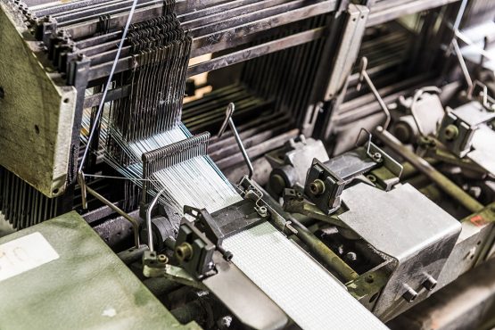 Belt weaving machine